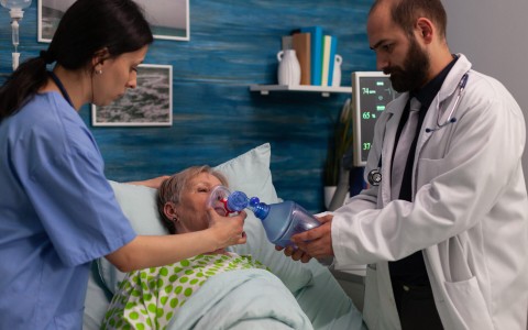 Doctor assisting woman in emergency