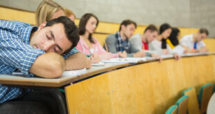 male-sleeping-with-students-in-lecture-hall-