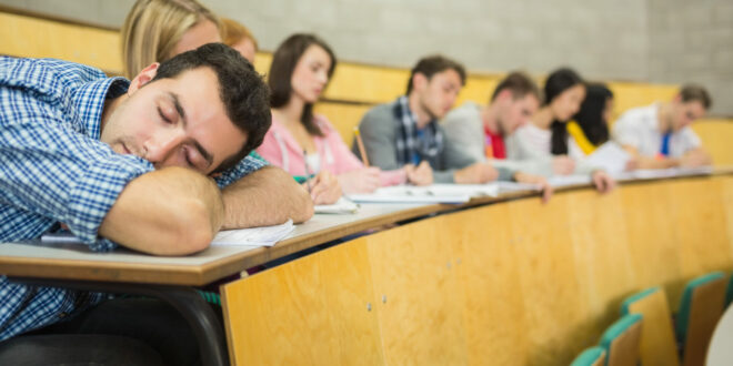male-sleeping-with-students-in-lecture-hall-