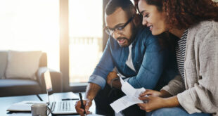 Young couple planning their budget