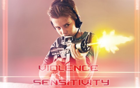 Young boy playing violent video game