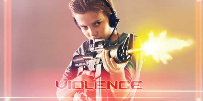 Young boy playing violent video game