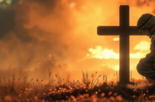 Christian soldier kneeling before a cross