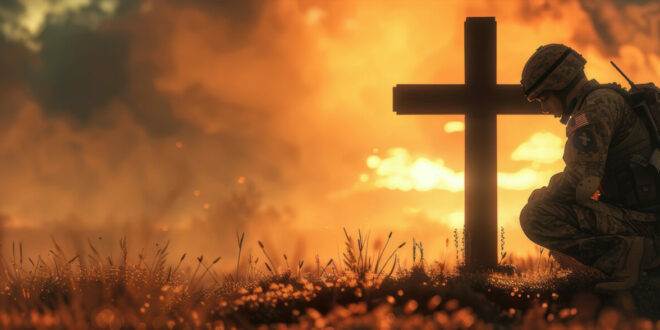 Christian soldier kneeling before a cross